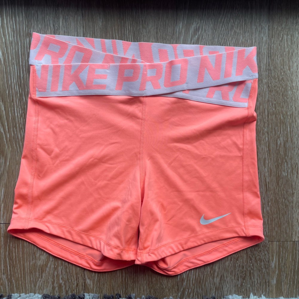 Coral x waistline Nike Pro shorts